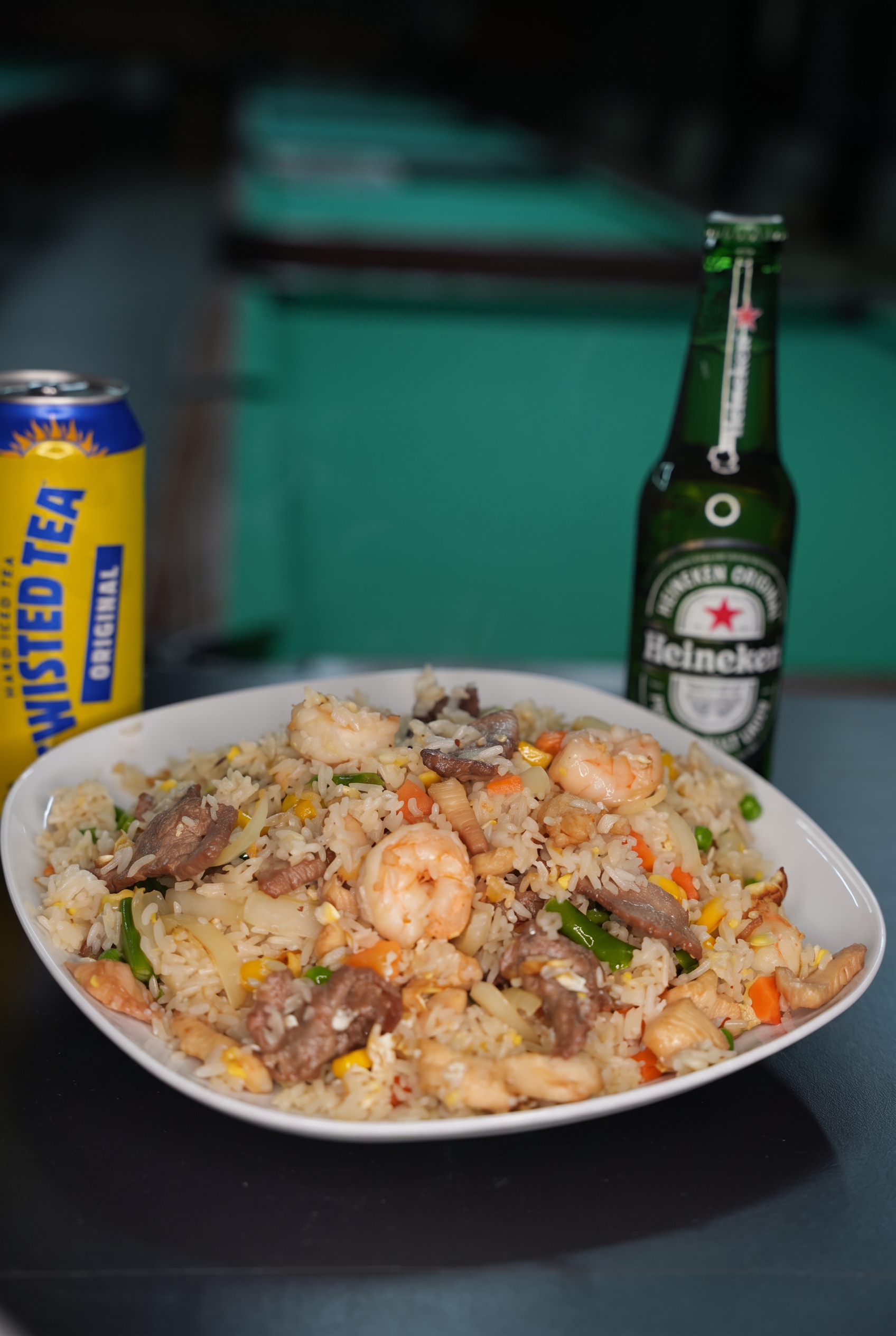 House fried rice with shrimp and beef served with a cold beer